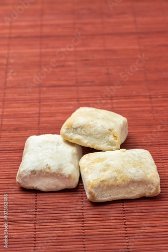 Typical Christmas sweet (Hojaldrina) similar to polvorón and mantecado, made with layers of puff pastry inside. photo