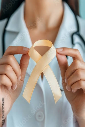 Doctor Holding A Peach Ribbon, Childhood Cancer And Bone Cancer Awarness, September Concept. photo