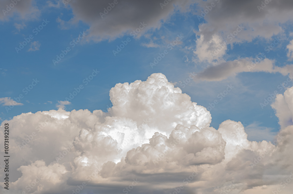 abstract background of white fluffy clouds on a bright blue sky abstract background of white fluffy clouds on a bright blue sky