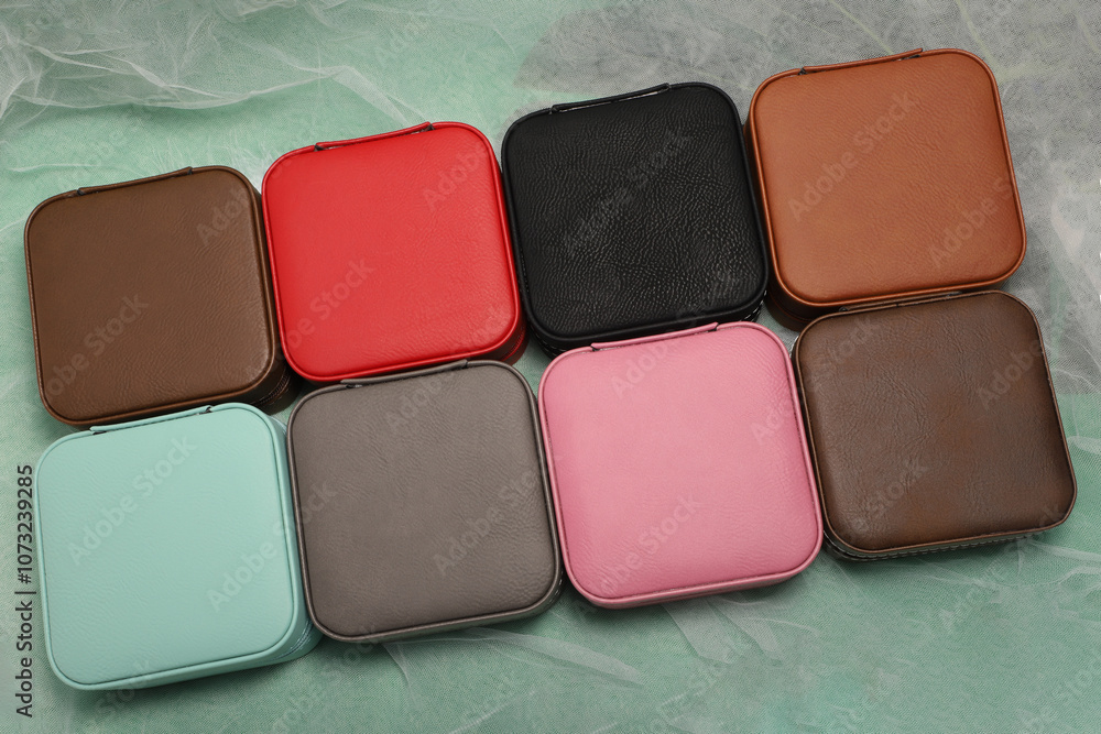 Diffirent colors leather jewelry box. Concept shot, top view. Custom background jewelry box view. Jewelry box and accessories. Diffirent colors leather jewelry box. Concept shot, top view. Custom background jewelry box view. Jewelry box and accessories.