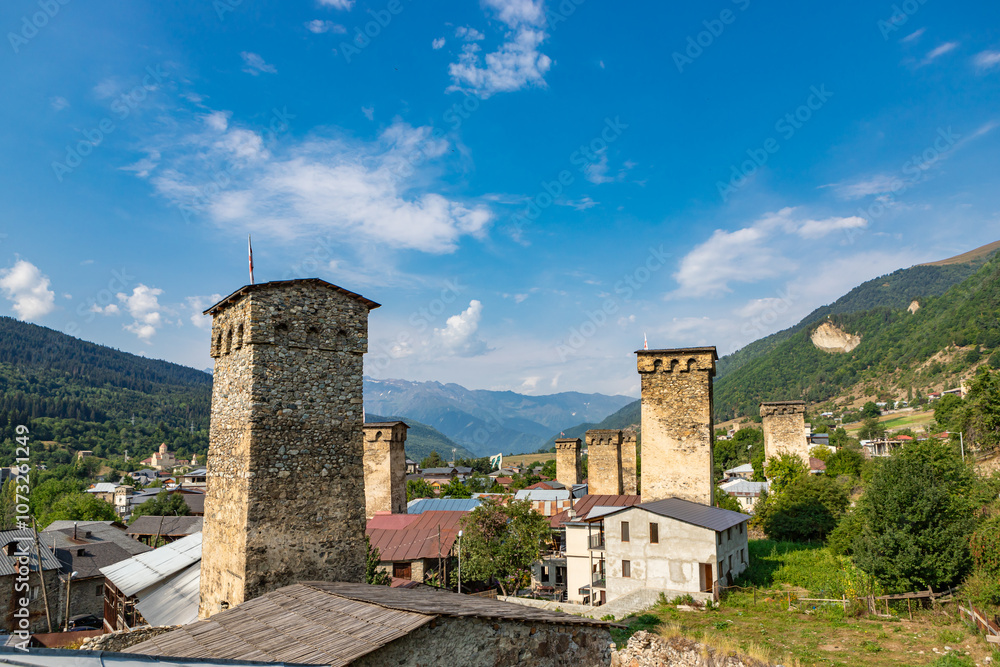 Mestia town in Georgia. The medieval Svan Towers is a traditional fortified residence in Mestia, Georgia. Svan towers and structures surrounded by green colors.