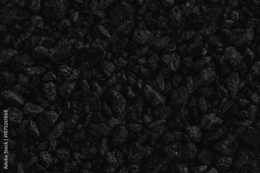 Dark stone texture. Black background of stones close-up Dark stone texture. Black background of stones close-up