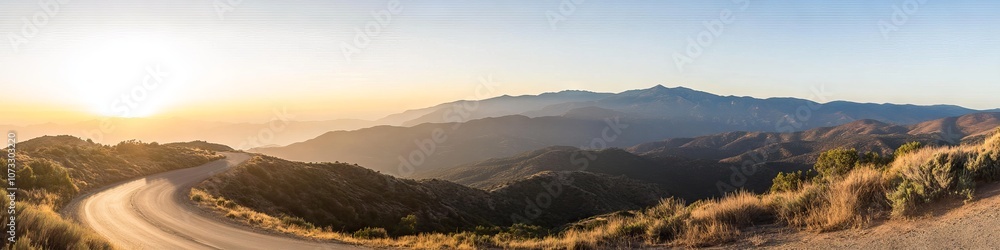 curved mountain road stretching into distance, desert sage brush, sun setting behind peaks, dusty golden landscape, rugged terrain, sweeping vista, crisp afternoon light, panoramic wilderness shot curved mountain road stretching into distance, desert sage brush, sun setting behind peaks, dusty golden landscape, rugged terrain, sweeping vista, crisp afternoon light, panoramic wilderness shot