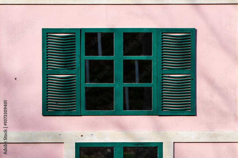 Fototapeta premium green window in the pink wall