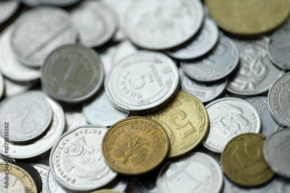 Big pile of different coins from various currencies and different countries around the world. Currency exchange Big pile of different coins from various currencies and different countries around the world. Currency exchange