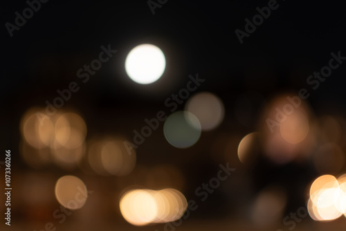 Blurred image of evening city lights close up