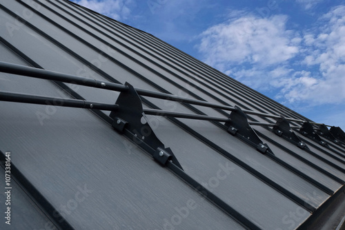 Snow guards for standing seam metal roofs photo