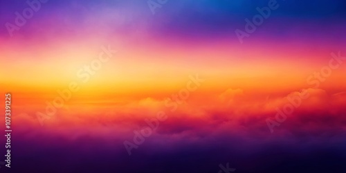 Abstract Sunset Over a Sea of Clouds with Vivid Colors of Orange, Yellow, Red, and Purple