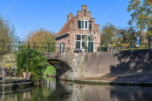 The front of a historic (1622) building, the fire engine house, is located on the city canal. The building is now an Indian restaurant. photo