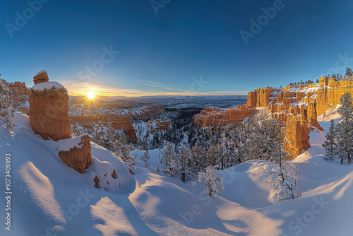 Snow-Covered Canyon Landscape at Sunrise photo