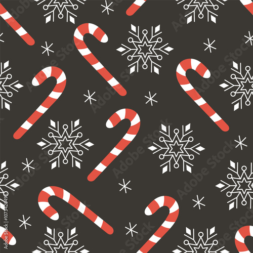 Christmas seamless pattern with red and white candy canes, snowflakes on a dark background