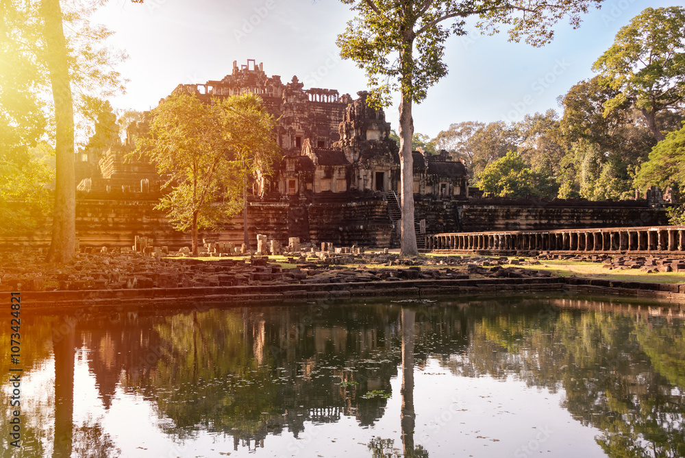 Fototapeta premium Angkor ancient temple ruins by lake in Cambodia