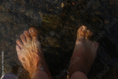 legs in the lake water