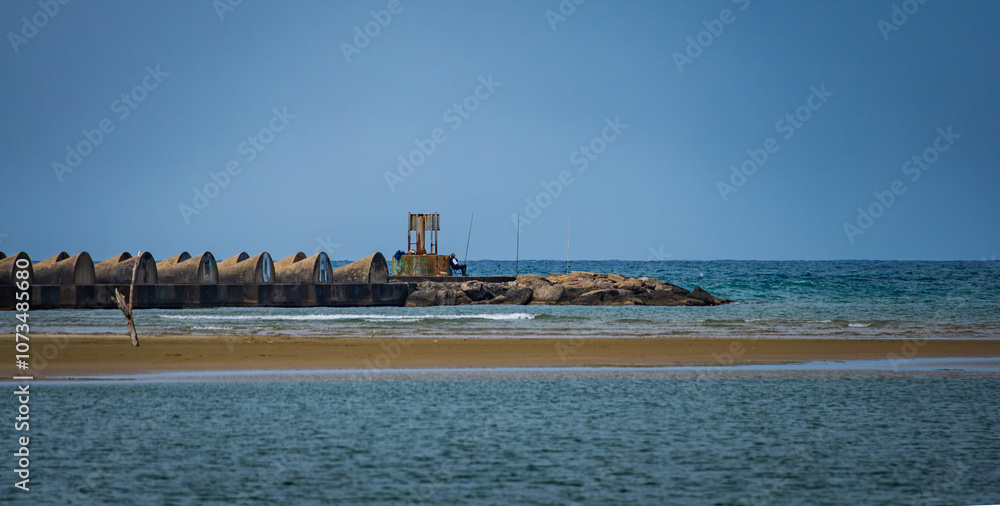 Fototapeta premium people fishing on the expoes in the sea