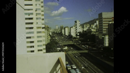 Camera panning over busy caracas venezuela streets from high rise building photo