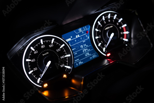 фотографія Light with car mileage with black background,number of speed,Odometer of car