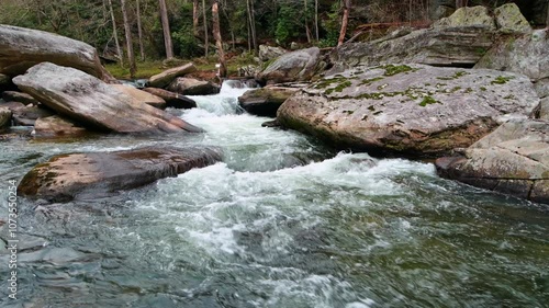 Rising pan of rapids and forest of the Linville Gorge, North Carolina in winter, with ambient sounds.