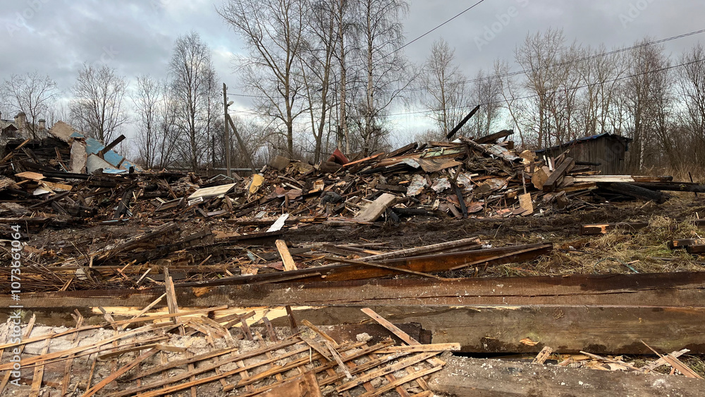 Ruins of a Collapsed Wooden House with Construction Debris and Wreckage, Post-Demolition Scene