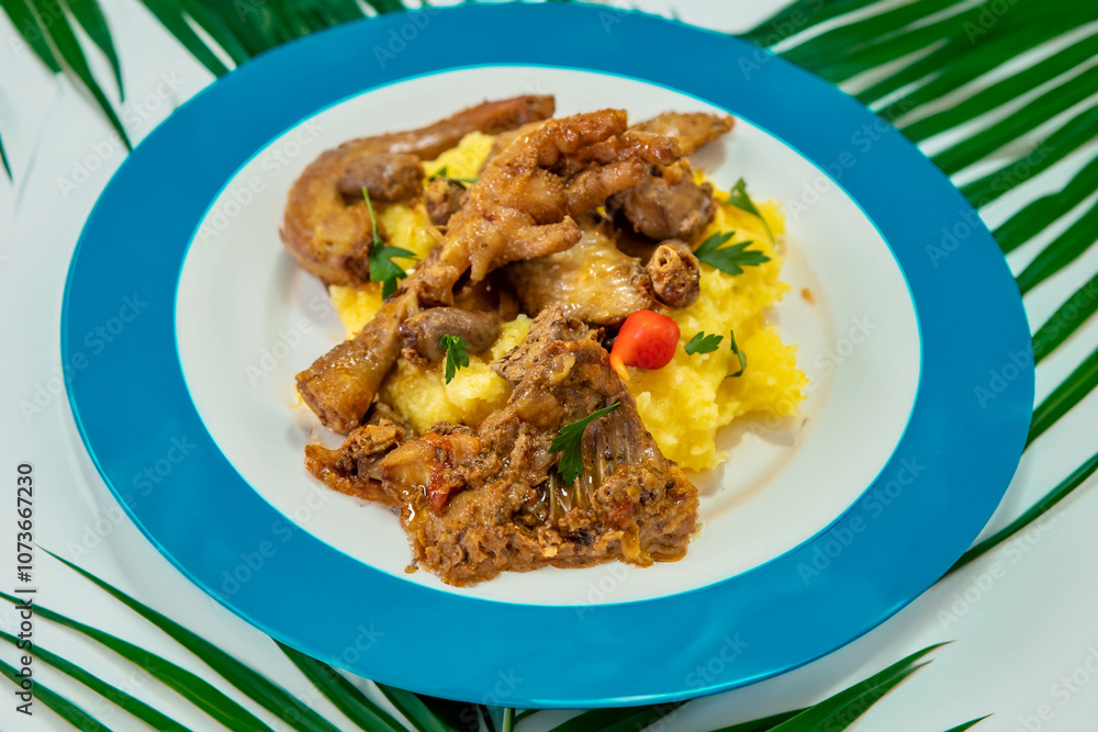 Traditional and rustic Brazilian dish, free-range chicken with polenta. Real food Traditional and rustic Brazilian dish, free-range chicken with polenta. Real food