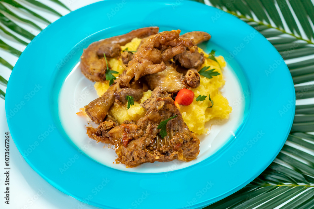 Traditional and rustic Brazilian dish, free-range chicken with polenta. Real food Traditional and rustic Brazilian dish, free-range chicken with polenta. Real food