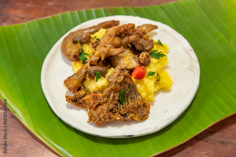 Traditional and rustic Brazilian dish, free-range chicken with polenta. Real food Traditional and rustic Brazilian dish, free-range chicken with polenta. Real food