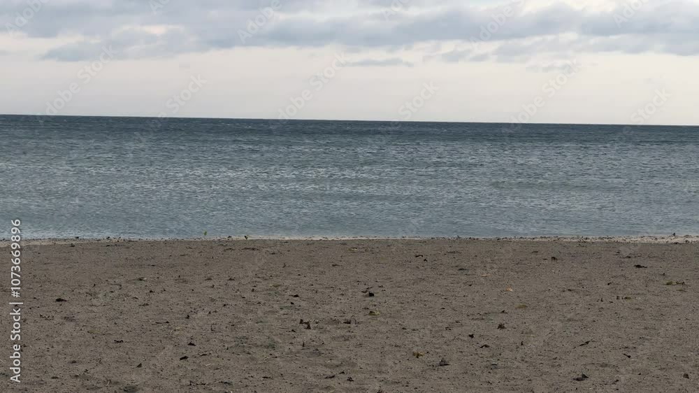 Beach and sea. Cloudy, windy weather by the sea. Sea beach in autumn. Beach and sea. Cloudy, windy weather by the sea. Sea beach in autumn.