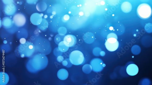 Abstract blue bokeh background with a dreamy, out-of-focus look.