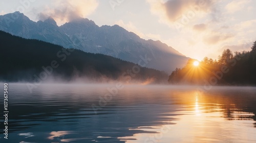 Wallpaper Mural Sunrise over a still lake, with fog rolling across the water, mountains in the background and the golden sun shining. Torontodigital.ca