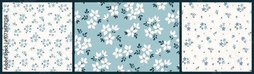 Seamless floral pattern, liberty ditsy print, abstract ornament in gentle spring motif. Simple cute botanical design: small hand drawn white flowers, tiny leaves, bouquets on blue. Vector illustration
