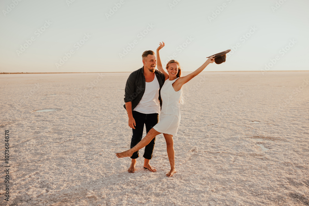 pink Lemurian lake, romantic photoshoot of young couple in love pink Lemurian lake, romantic photoshoot of young couple in love