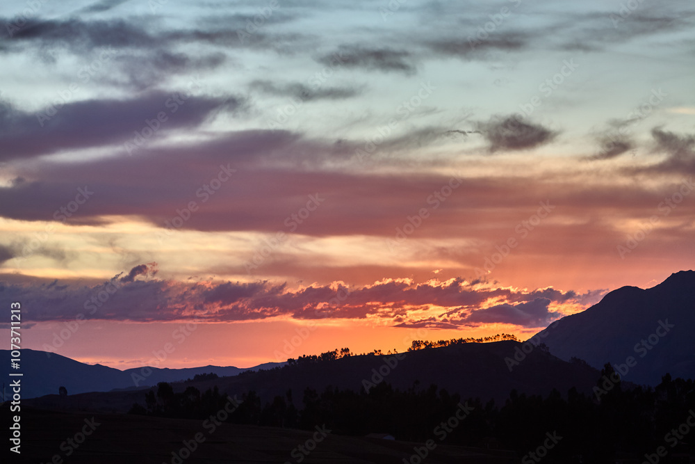The sun dips below the hills of Chinchero, casting a golden embrace over this sacred land.Nature and history blend seamlessly as the day ends, reminding us of the timeless beauty of Peru’s Andes. The sun dips below the hills of Chinchero, casting a golden embrace over this sacred land.Nature and history blend seamlessly as the day ends, reminding us of the timeless beauty of Peru’s Andes.