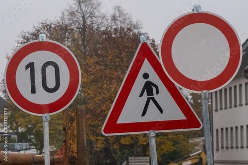 Speed limit, pedestrian crossing and no vehicles road signs showing traffic regulations photo