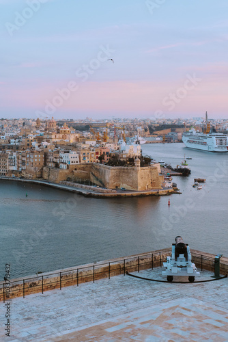 Cannons against the background of the Grand Harbour of Valletta, Malta