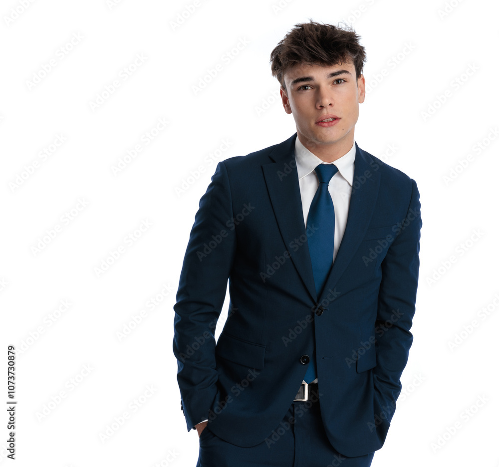 sexy young businessman in his 20s holding hands in pockets sexy young businessman in his 20s holding hands in pockets