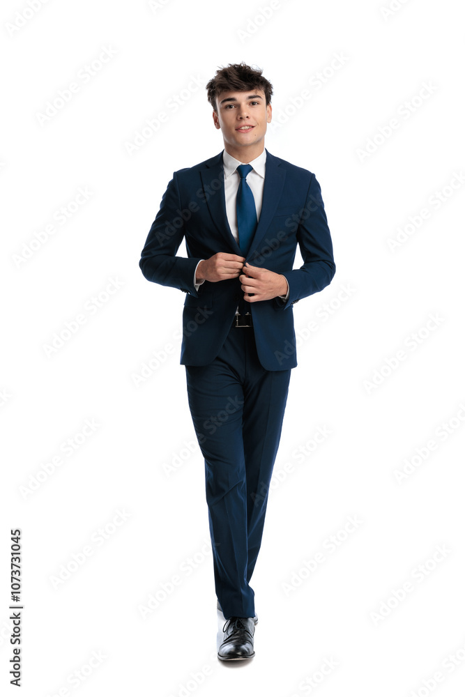 confident businessman smiling and closing navy blue suit confident businessman smiling and closing navy blue suit