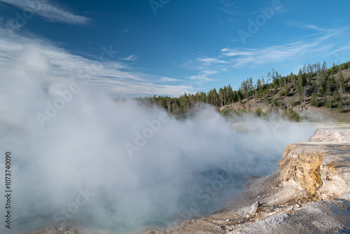 Steam rises from the Excelsior Geyser within Yellowstone Park in Montana