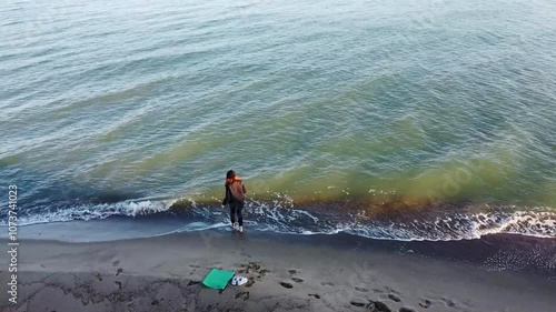 Drone Footage: Girl Walking on the Beach