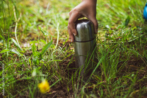 Hide the money in the bank.A time capsule.Metal thermos for storage. A message to the future.