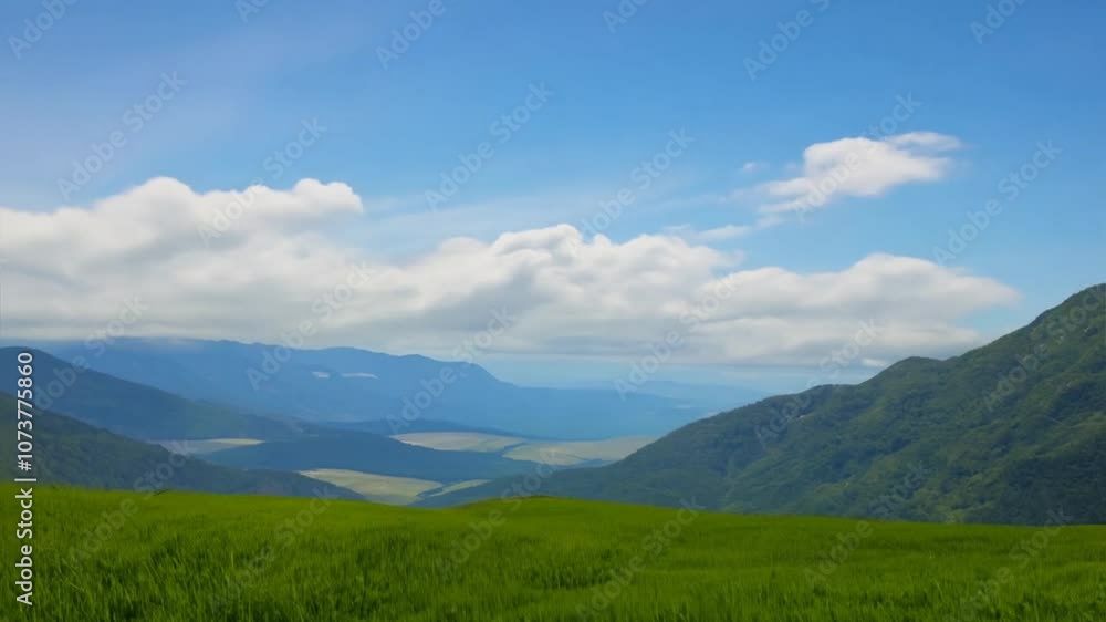 Lush Green Mountain Landscape Under a Blue Sky with Wispy Clouds and Gentle Rolling Hills in the Background, Perfect for Travel and Nature Themes Lush Green Mountain Landscape Under a Blue Sky with Wispy Clouds and Gentle Rolling Hills in the Background, Perfect for Travel and Nature Themes