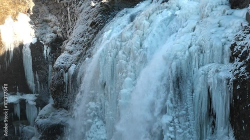 Wallpaper Mural Experience the breathtaking sights of a winter wonderland with cascading frozen waterfalls and majestic ice formations, all set within a tranquil and secluded natural environment. Torontodigital.ca