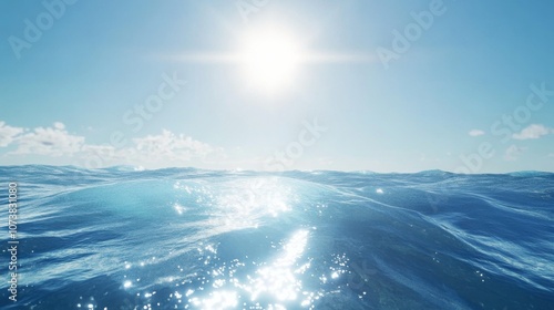 A serene view of the ocean with sparkling blue waves under a bright sun, conveying tranquility and peace.