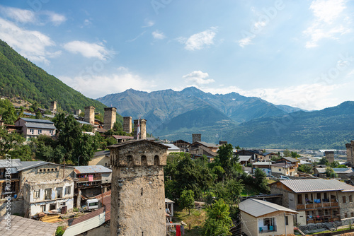 Mestia town in Georgia. The medieval Svan Towers is a traditional fortified residence in Mestia, Georgia. Svan towers and structures surrounded by green colors. photo