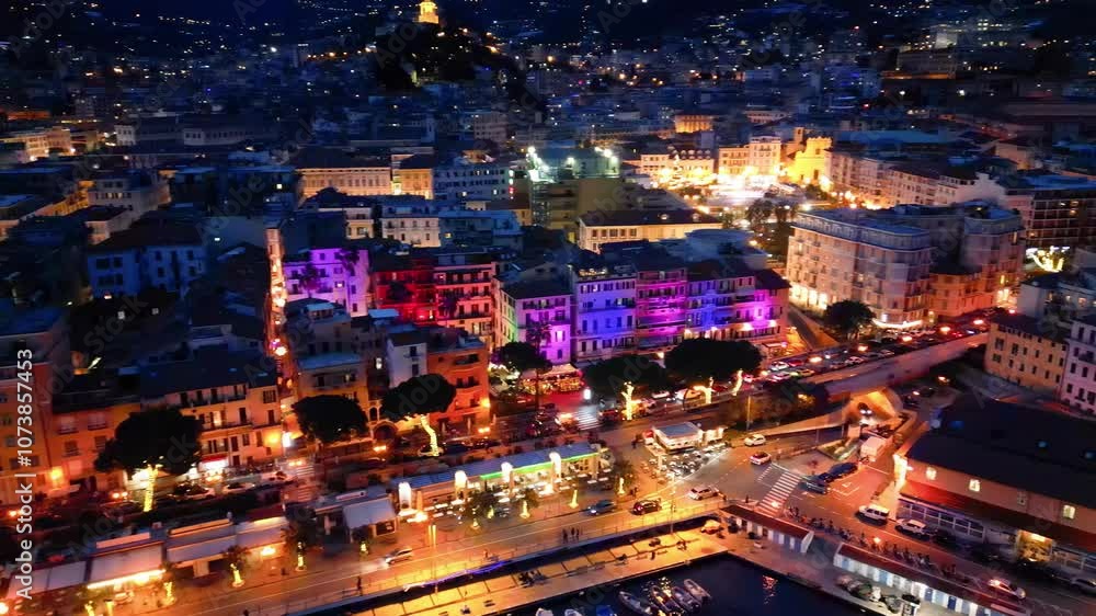 Aerial view of Sanremo at night, Italy. Port and city buildings Aerial view of Sanremo at night, Italy. Port and city buildings