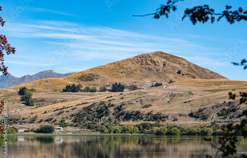 Gorgeous views of lake hayes in New zealand clear day hills photo