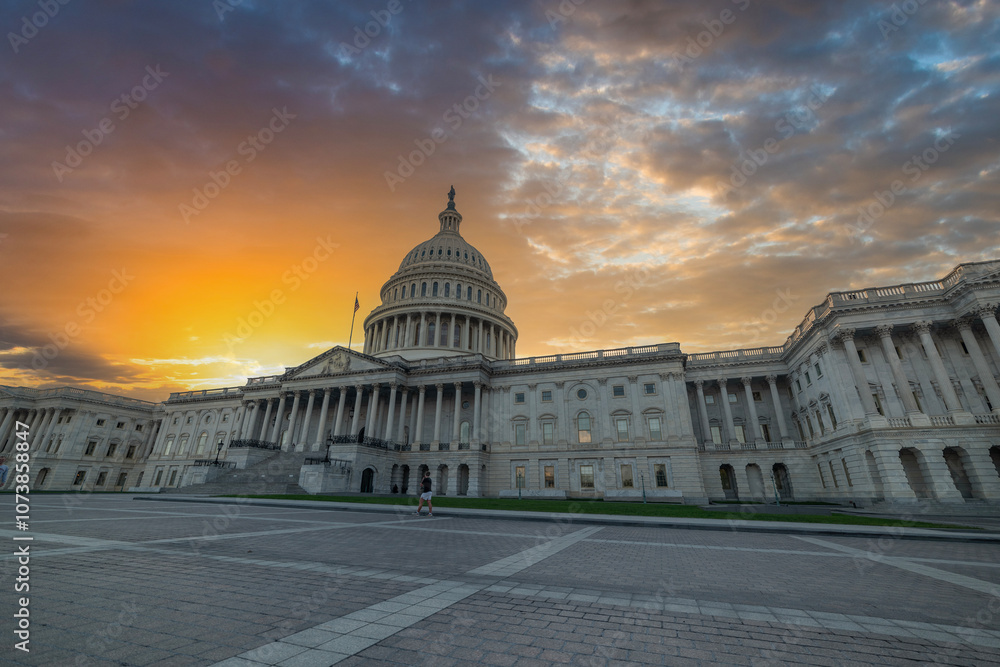 Sun shining over United States Capitol Building at sunset Sun shining over United States Capitol Building at sunset