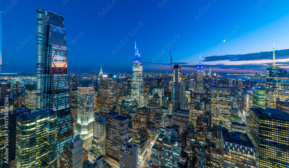 Manhattan skyline by night under a clear sky