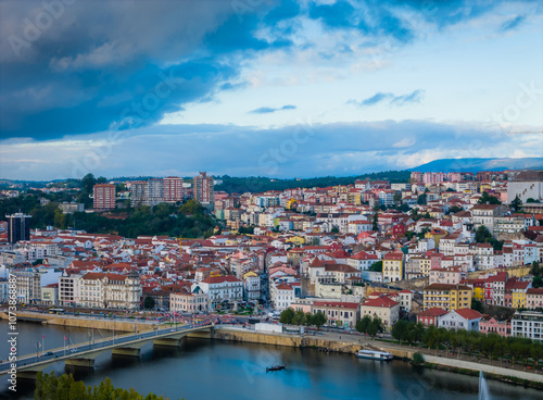 Aerial view of Coimbra city old town on the hill. Panoramic drone cityscape and Mondego River, Portugal