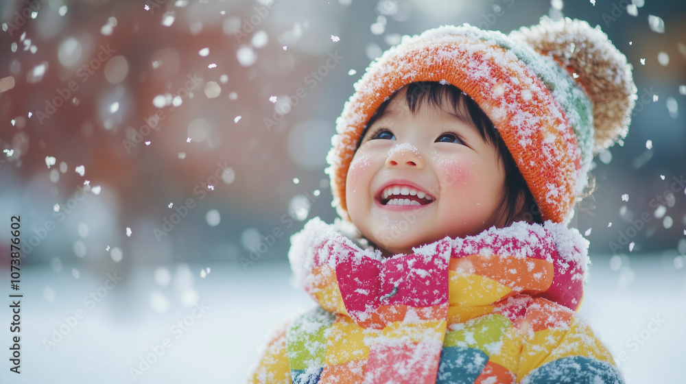 Joyful child playing in the snow during winter, surrounded by falling snowflakes in a park Joyful child playing in the snow during winter, surrounded by falling snowflakes in a park