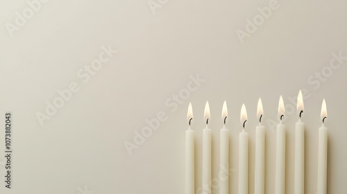 Minimalist shot of embossed hanukkah candles on beige background   ideal for promotional designs photo