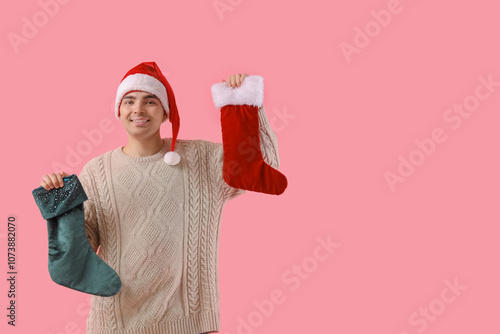 Young man in Santa hat with...